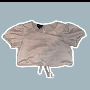 B.wear beige tie back cropped blouse.